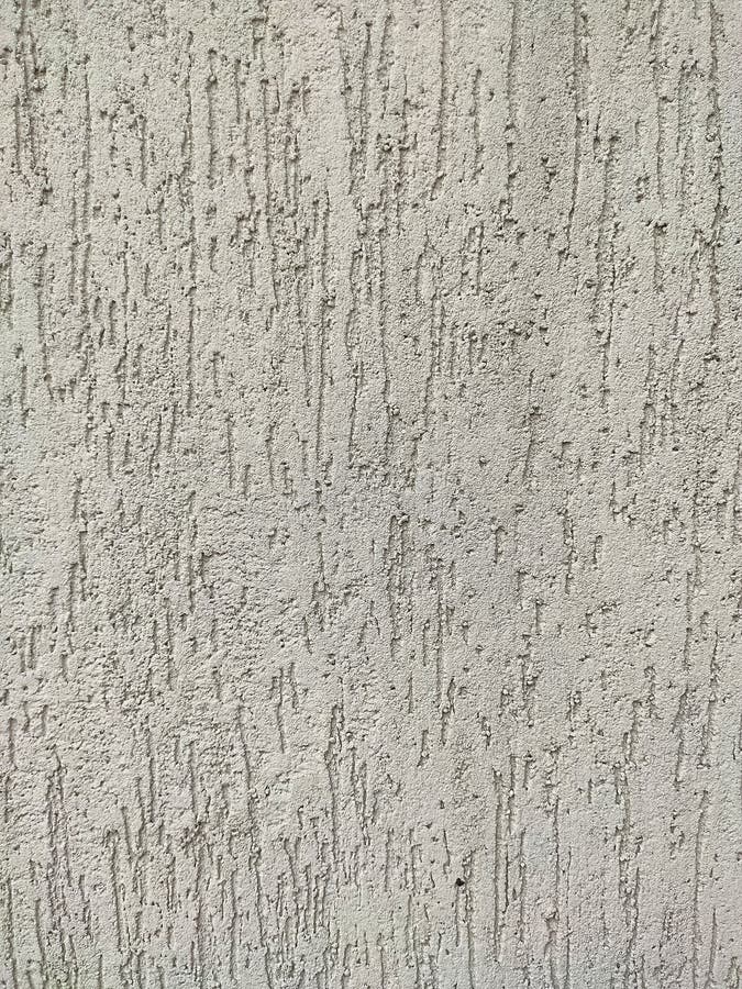 Texture of the grey plaster bark beetle on the wall. Seamless texture. The texture of the plaster is bark beetle on the wall. Seamless grey texture royalty free stock photography